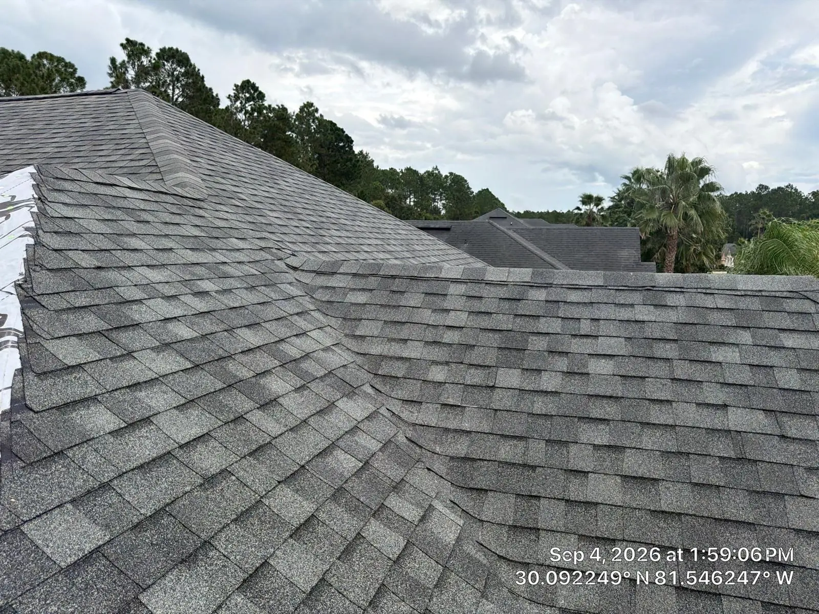 The same roof finished with new architectural shingles